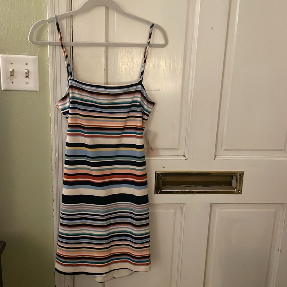 Short multi color dress. Open back w/ tie. Bra style straps to get the right fit
